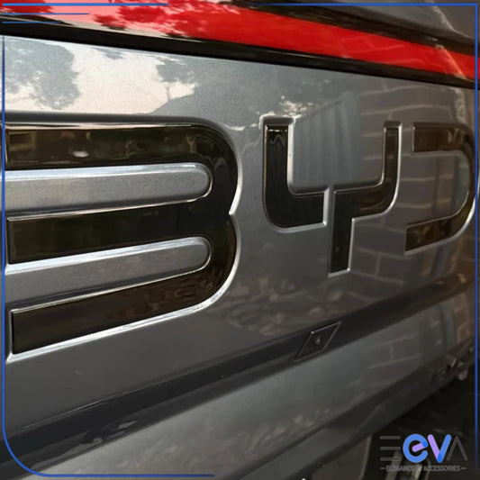 BYD Shark 6 rear badge close-up view showing smooth gloss black ABS finish and clean fitment on the tailgate from EEVA Store Australia.