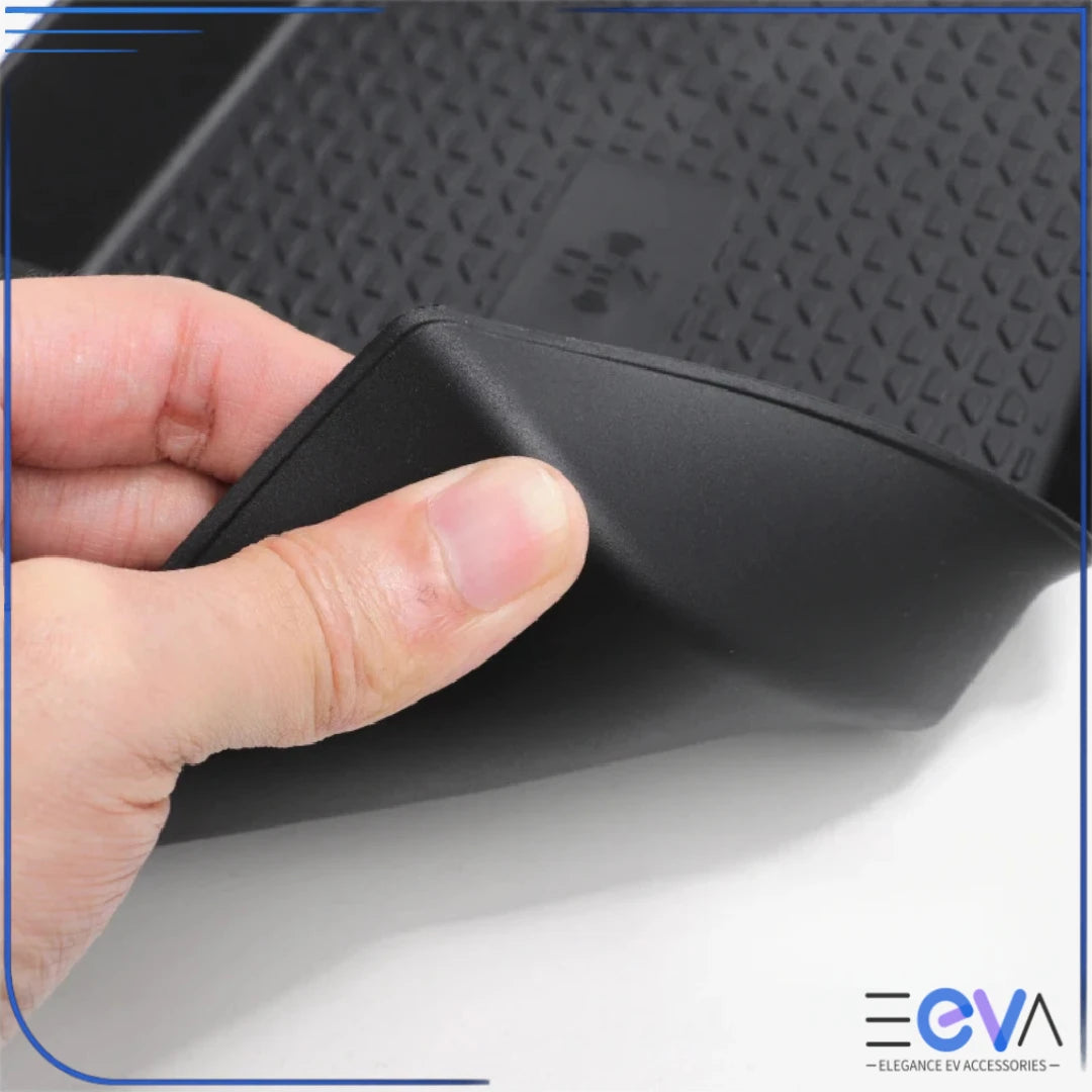 BYD Atto 2 lower storage box showing flexible rubber edges and textured padding for secure item placement from EEVA Store Australia.
