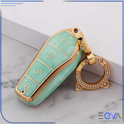 BYD car key case in emerald green with cat ear buckle keychain, showing decorative clasp and secure protective fit from EEVA Store Australia.