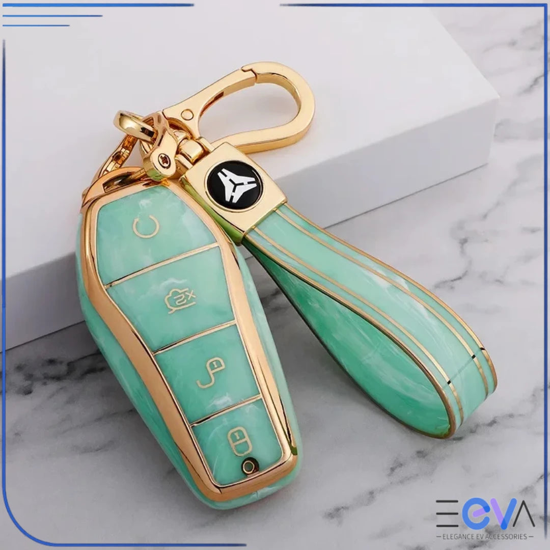 BYD car key case in emerald green gemstone style with strap keychain, highlighting rich colour and gold-edged frame from EEVA Store Australia.
