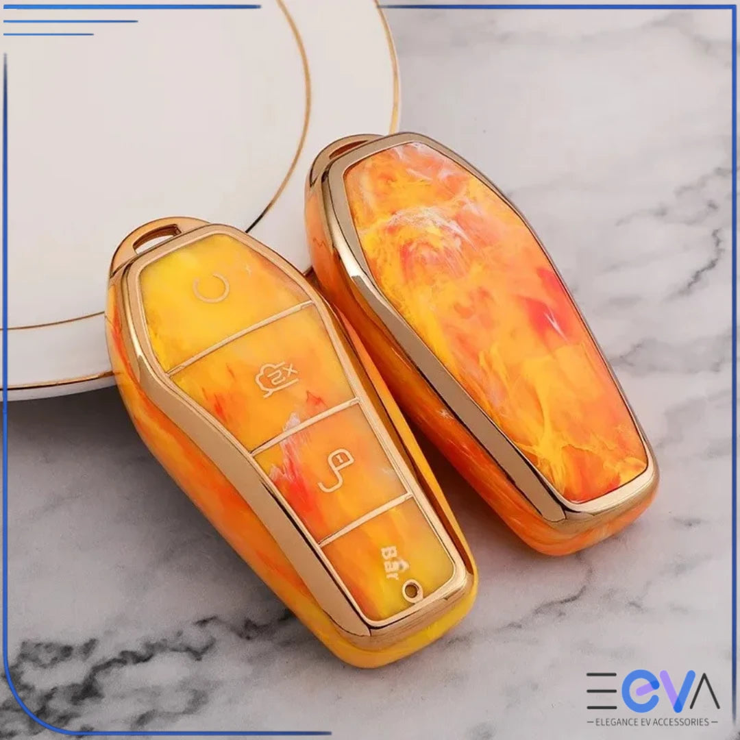 BYD car key case in fire opal orange shown without keychain, focusing on protective shell and gemstone pattern from EEVA Store Australia.