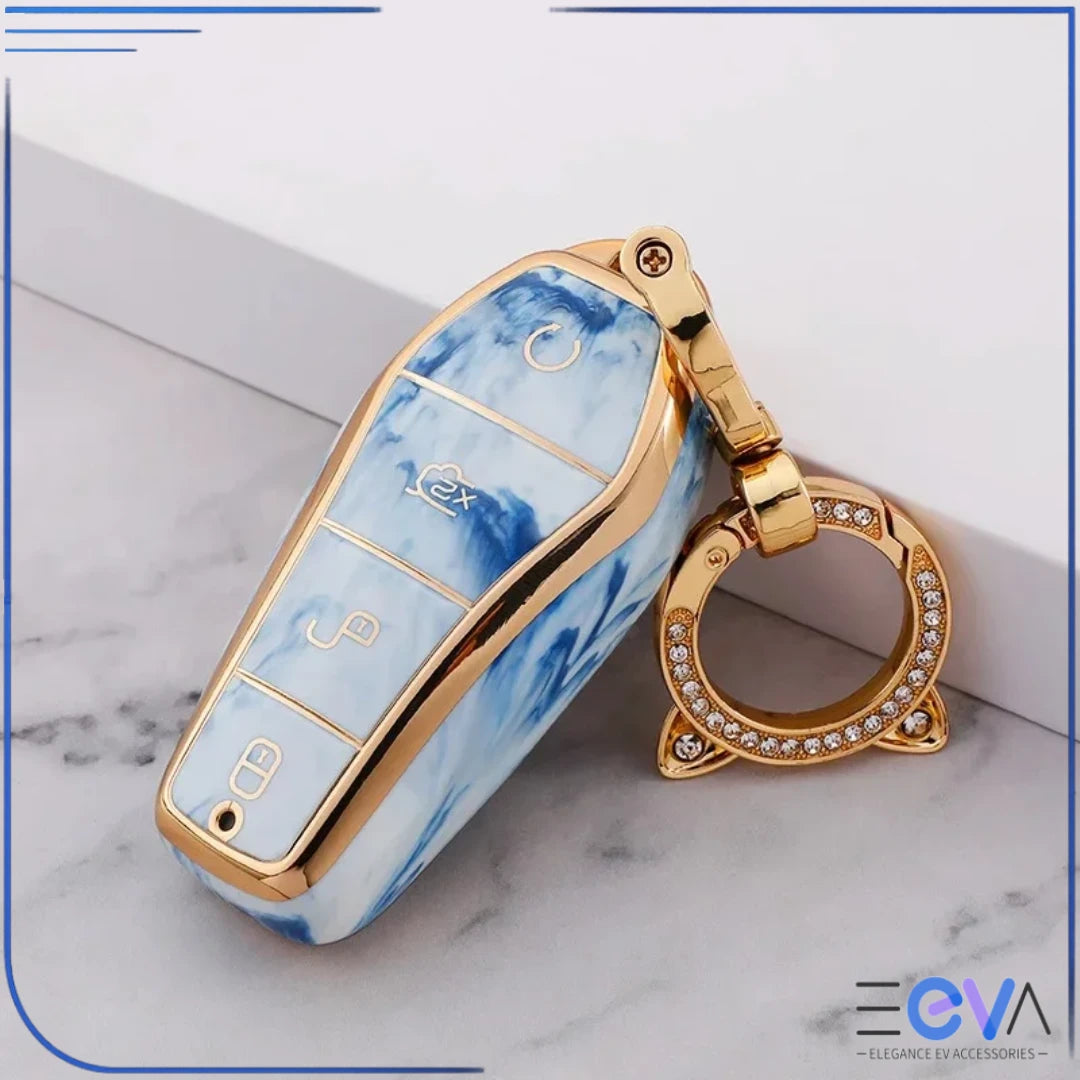 BYD car key case in larimar blue with cat ear buckle keychain, shown in an angled close-up view from EEVA Store Australia.