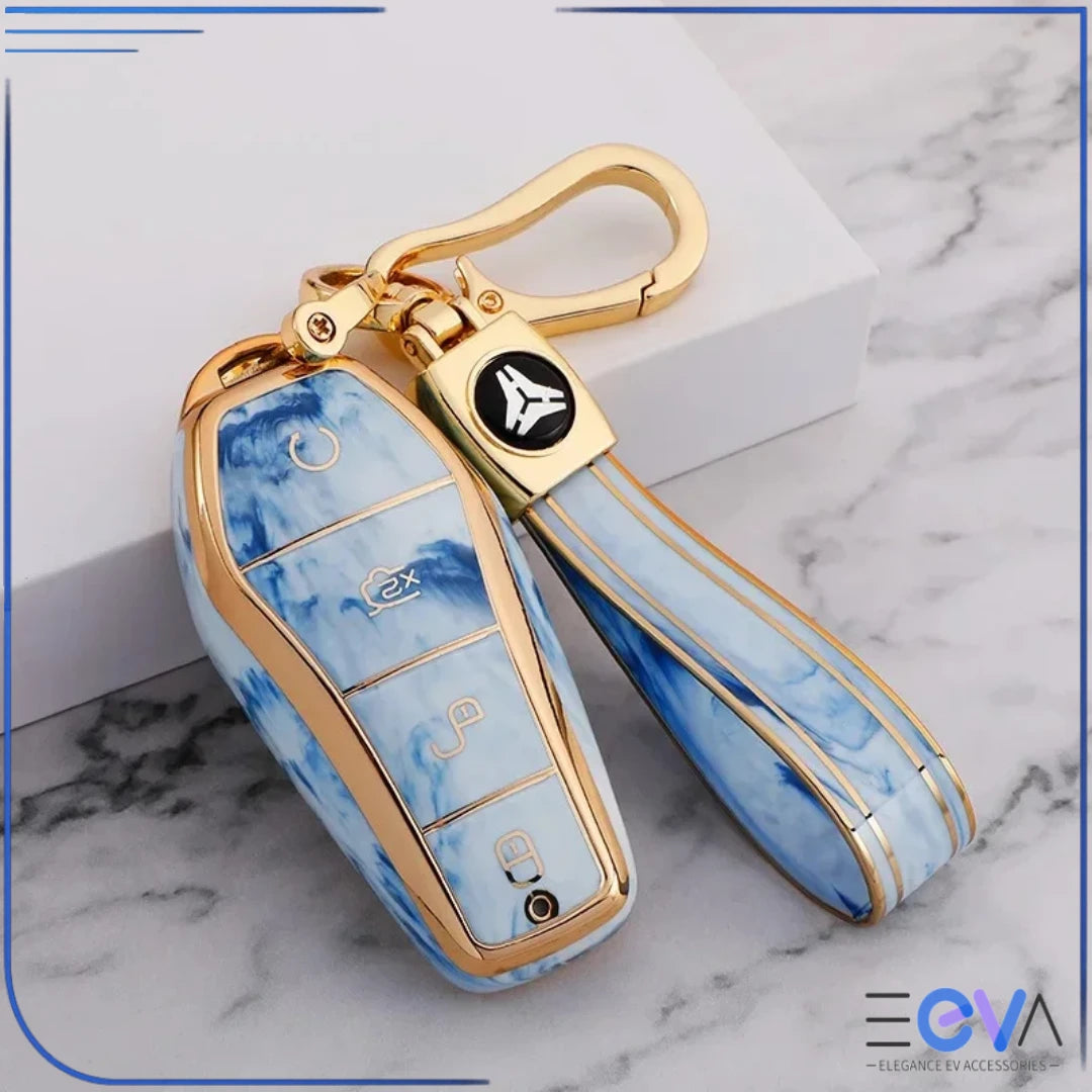 BYD car key case in larimar blue gemstone style with strap keychain, displaying glossy finish and gold trim from EEVA Store Australia.