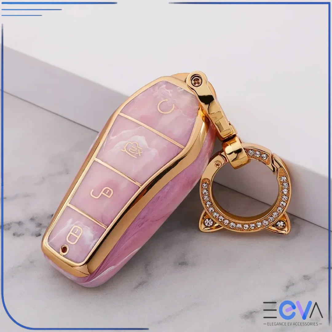 BYD car key case in pink tourmaline with cat ear buckle keychain, displayed in an angled close-up view from EEVA Store Australia.