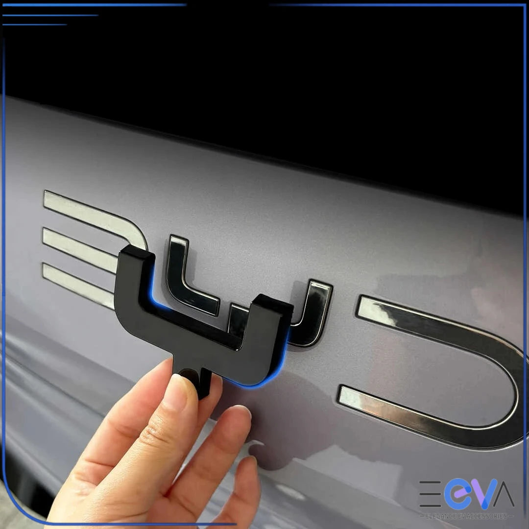 BYD Sealion 7 blackout rear badge cover being installed gloss black emblem overlay from EEVA Store Australia
